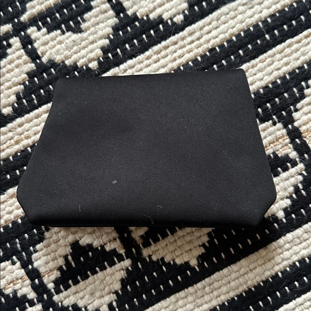 SKIMS Black Embossed Pouch